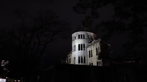 a tower lit up against the dark night sky