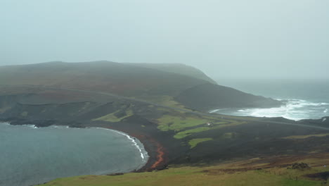 dramatic aerial drone shot over icelandic coastline