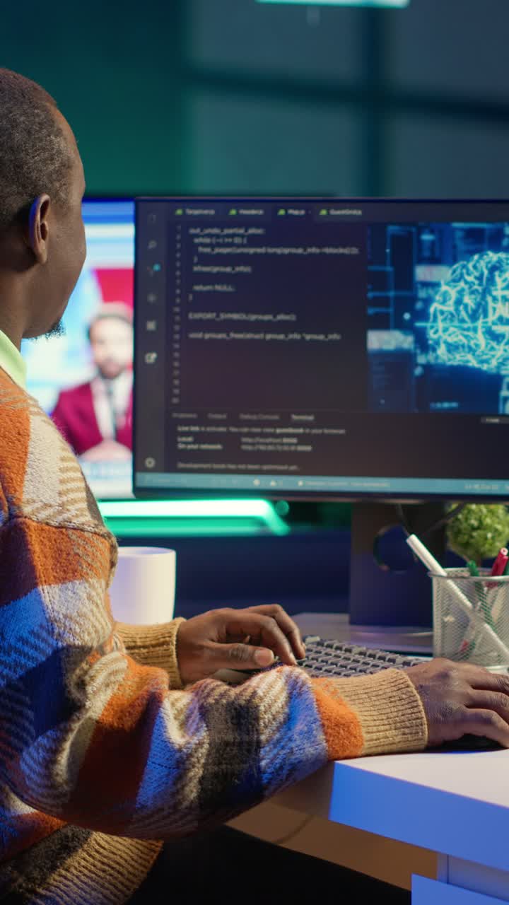 Vertical Video Professional male developer manages neural network at desk