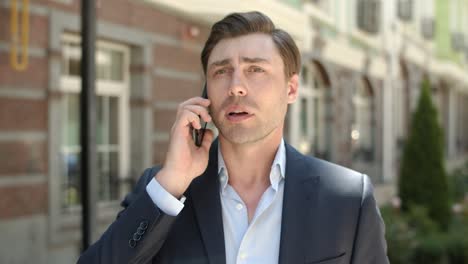 portrait man talking on phone about work. serious businessman calling partner