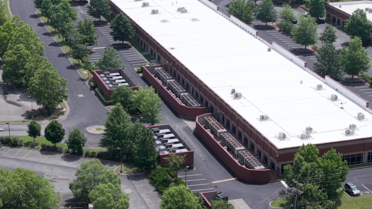 Flexential Data Center in the Franklin neighborhood of Nashville, Tennessee - tilt down ascending aerial reveal during daytime