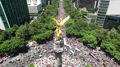 orbital-aerial-drone-shot-of-angel-of-independence-during-pride-parade-2023-in-mexico