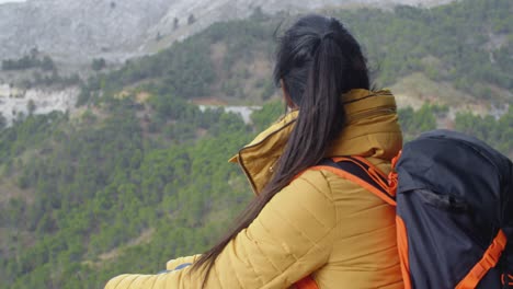 Female-backpacker-taking-a-rest