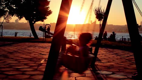 Little-Girl-Swaying-At-Golden-Summer-Sunset