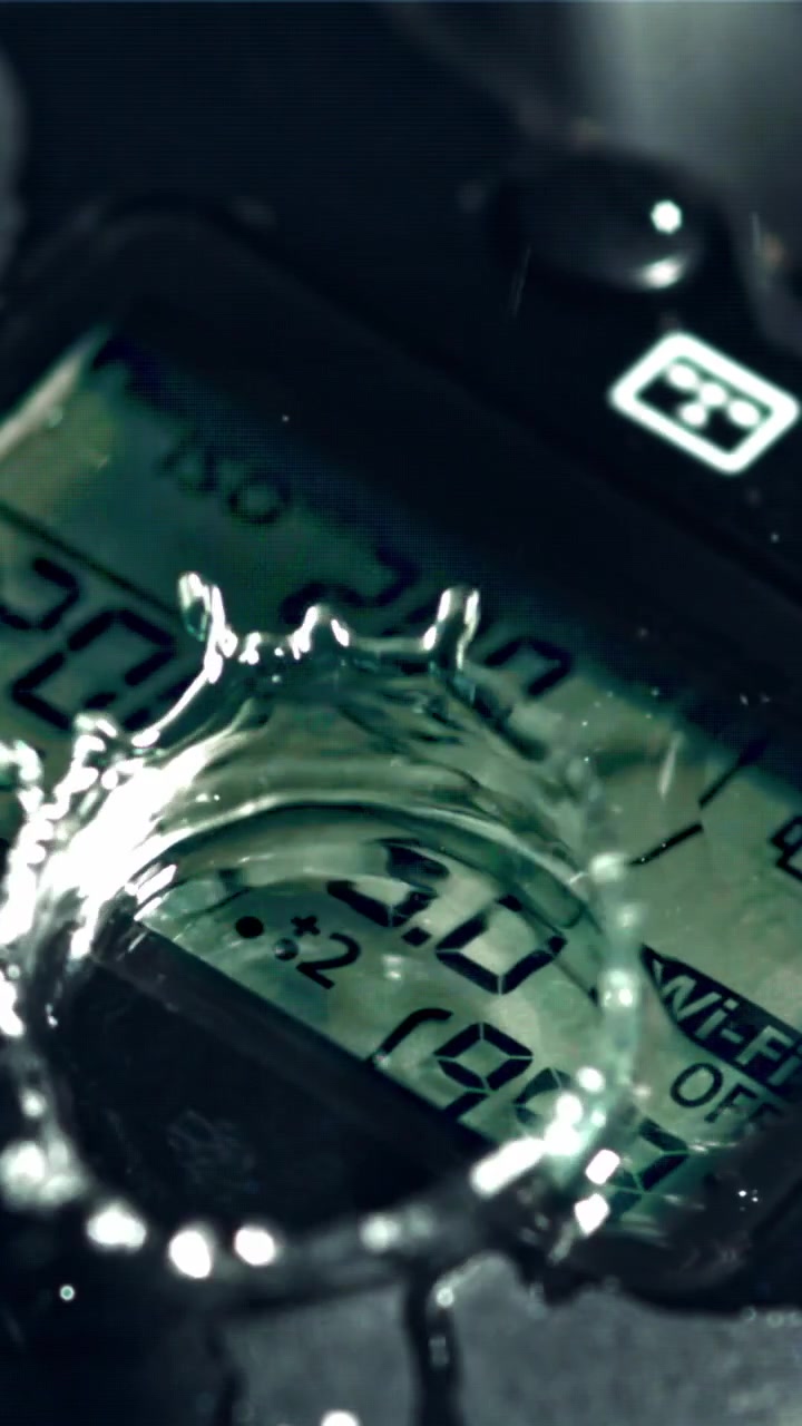 Slow Motion Water Drops Splashing on a Camera LCD Screen