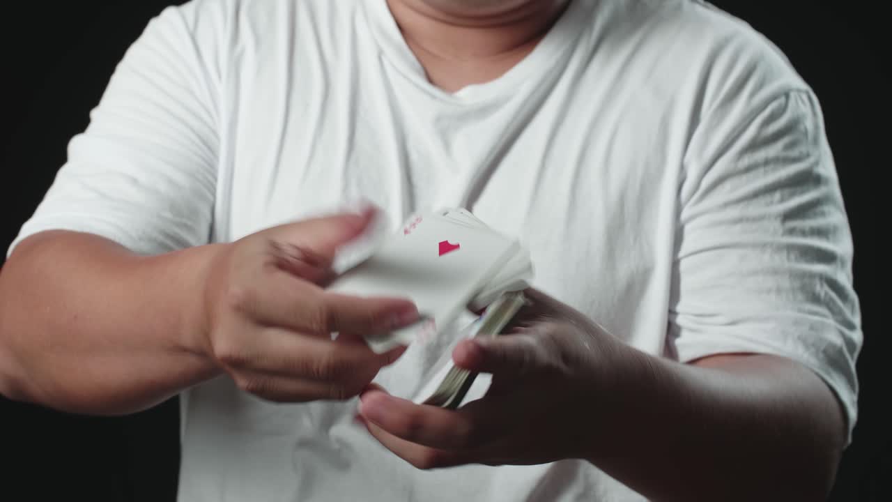 Magician Showing His Trick With Usual Cards