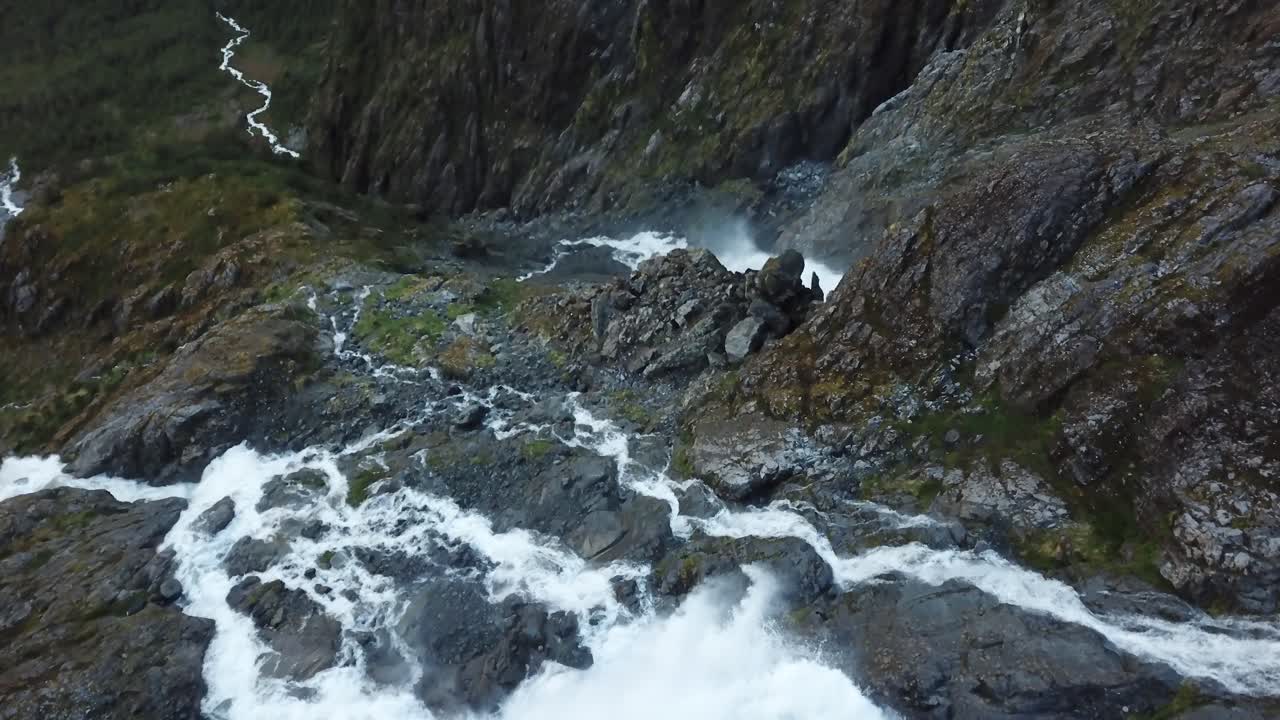 Queulat National Park, Chile, FPV Drone Aerial View of Glacial Waterfalls Down The Andes Mountains