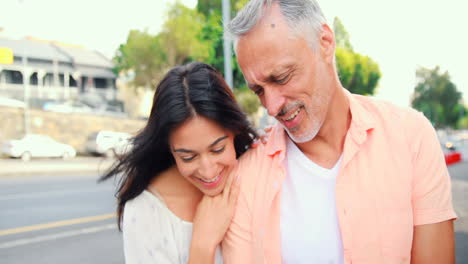 smiling couple using smartphone