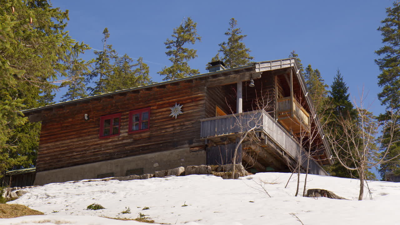 A View Of A Cozy Log Cabin In The Bavarian Alps In Germany. Static Shot
