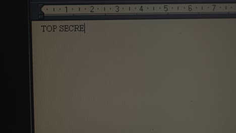 subject 'top secret' typing on old operating system computer screen