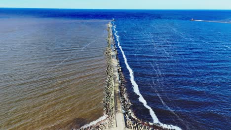 aerial perspective of mangalsala, coastal area where daugava river meets baltic sea in riga, latvia