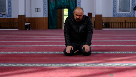 man turning his head in mosque