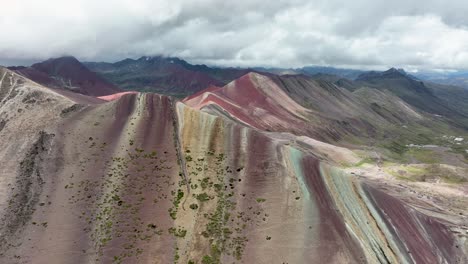 Aerial-fly-drone-view-of-Rainbow-Mountain-,-Vinicunca,-Cusco-Region,-Peru