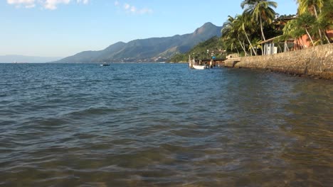 crystalline paradisiac beach in ilhabela island in sao paulo coastline, brazil, at summer day