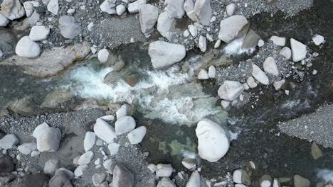 Aerial drone view following cascading river