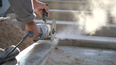 construction worker cutting concrete