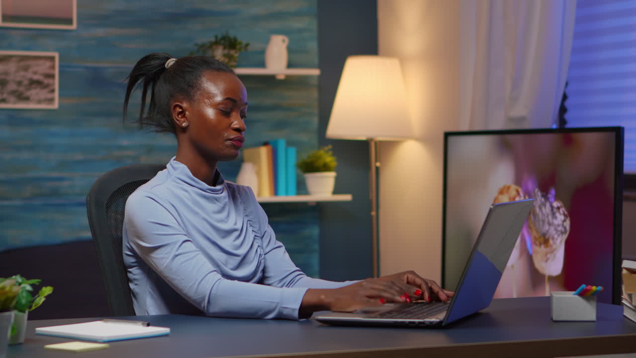 Tired black businesswoman working overtime reading projects