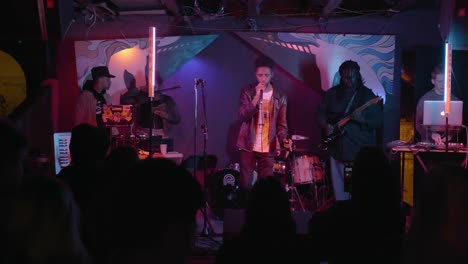 atlanta, ga - december 15, 2018: a rising star in the southeastern rap scene, boregard, performs in a hip-hop duo at a lively concert in an underground urban nightclub popular with millennials.