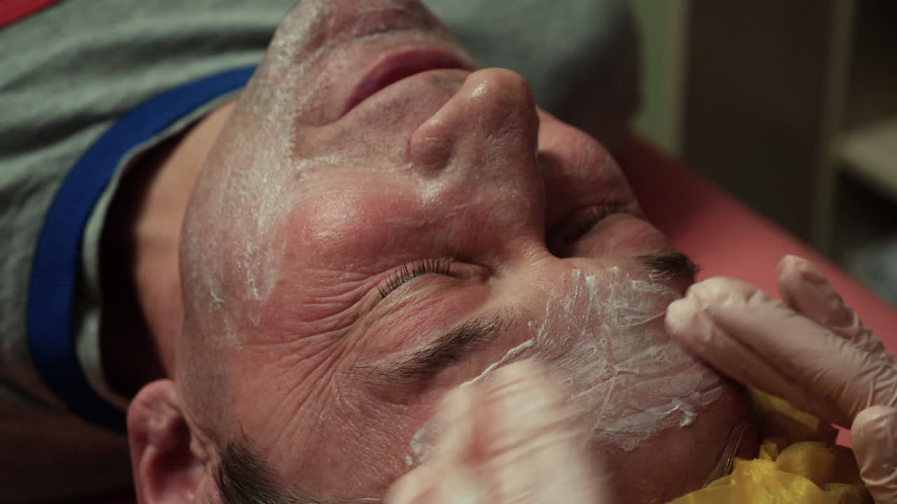 Man receiving skincare treatment