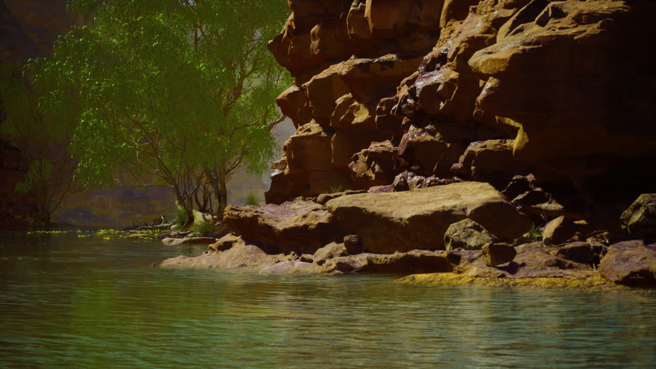 A peaceful water body reflects the warm hues of the surrounding rugged rocks