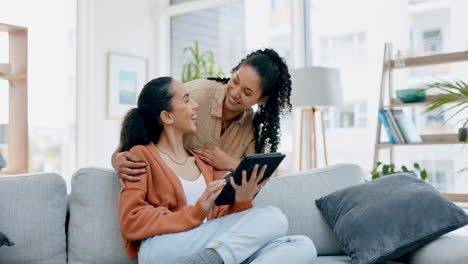 Lgbtq-couple,-tablet-and-hug-on-home-sofa-to-relax