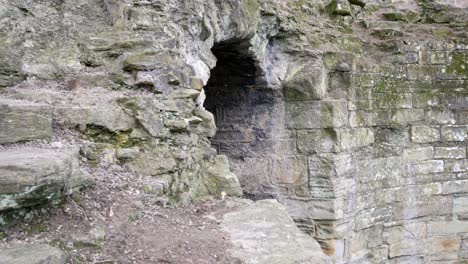 ancient basingwerk abbey abandoned historical landmark building stone walls close dolly right