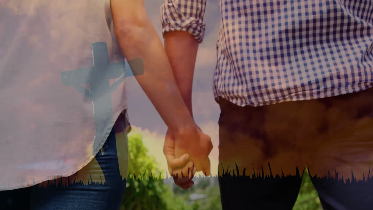 Couple holding hands outdoors, overlay showing cross silhouette and grass for faith marketing