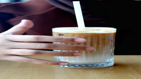 woman enjoying iced coffee