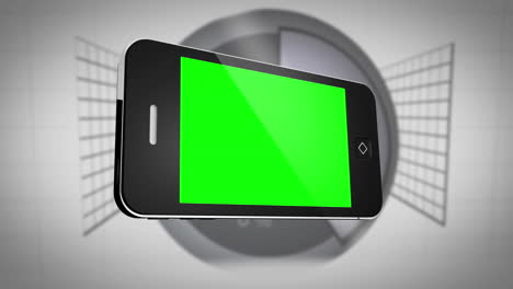 smartphone with green screen in front of statistics