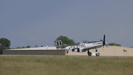 p-51 mustang takes off on runway