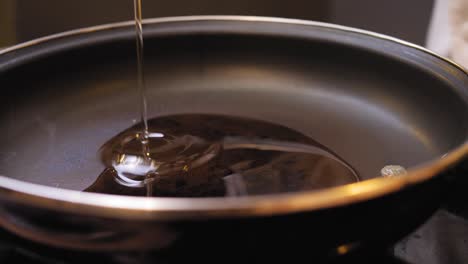 pouring-olive-oil-into-the-pan