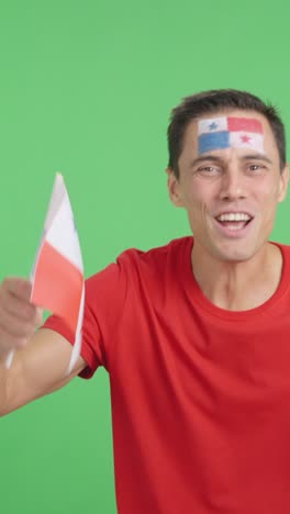 Man cheering for Panama screaming and waving a national flag