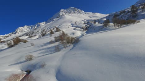 fpv-Drone-footage-of-a-peaceful-snowy-mountain-range