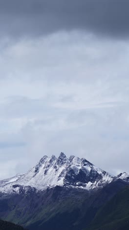 Snowcapped-Mountains-in-Ushuaia-in-Argentina,-Background-with-Copy-Space-of-Dramatic-Mountain-Scenery-and-Sky-in-Vertical-Video-for-Social-Media,-Instagram-Reels-and-Tiktok