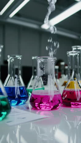 colorful liquids in beakers, laboratory experiment