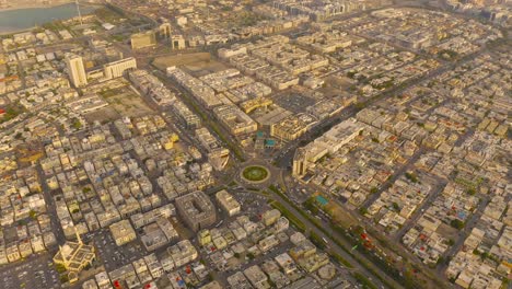 aerial top view of roundabout, highway junctions. roads or streets shape circle in structure of architecture and technology transportation concept. urban city, dubai downtown at sunset, uae country.