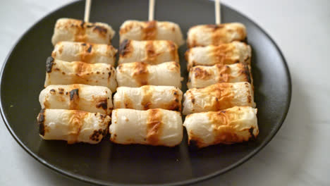 grilled tube shaped fish paste cake or tube squid skewer