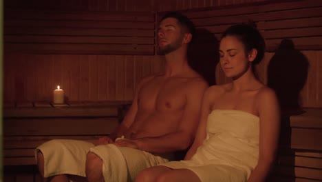 Couple-relaxing-in-sauna-together