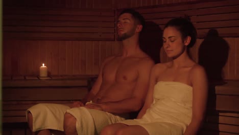 couple relaxing in sauna together