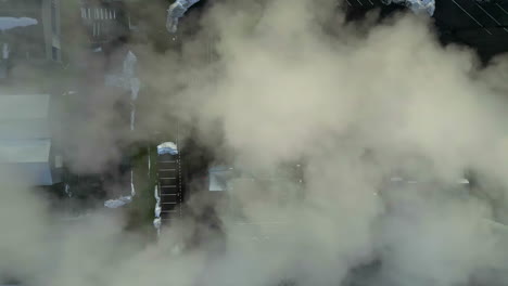 industrial power plant with exhaust water vapor steam, top down view overhead