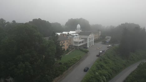 foggy morning aerial orbits stately charming old hotel, lambuth inn