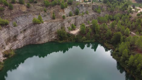 Sky-reflected-in-water-of-Pelag-Gran-lake-in-Vilobi-del-Penedes,-Catalonia