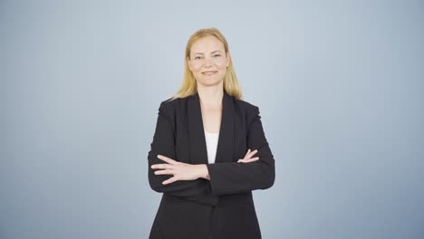 Business-woman-with-arms-folded-and-laughing-at-camera.