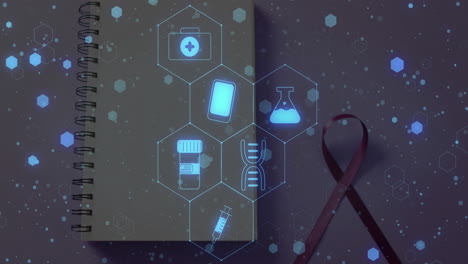 animación de iconos médicos sobre el cuaderno y la cinta
