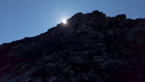 hiker in distance back lit sun revealed slow motion kananaskis alberta canada