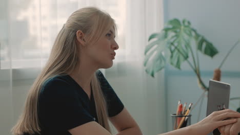 young caring nurse talking warmly with elderly man in the office 2