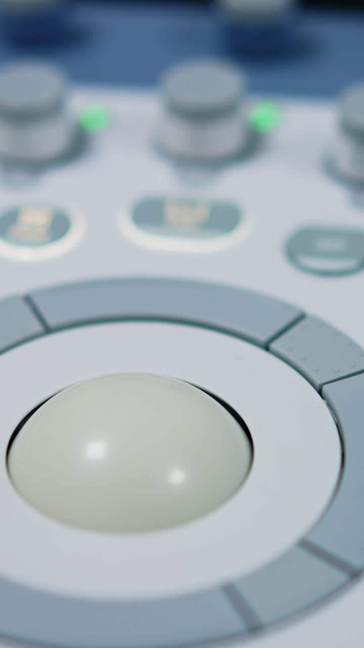 Round rotating button on the keyboard of modern medical equipment. Numerous buttons to manage machine for ultrasound diagnostics.