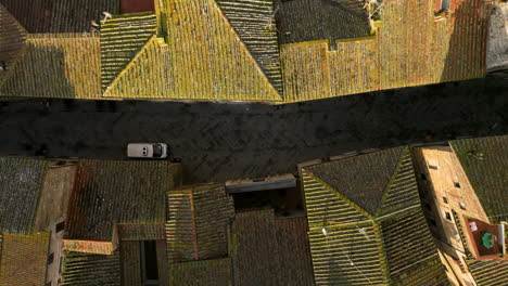 historic town with tiled-roof and stone houses in san gimignano in siena, tuscany, north-central italy