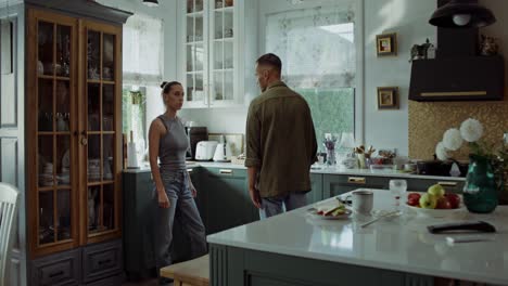 couple arguing in kitchen