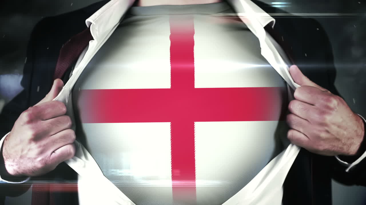 hombre de negocios abriendo la camisa para revelar la bandera inglesa